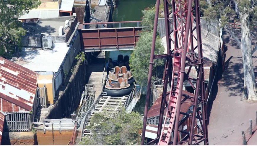 Three water rafts halted on the Thunder Rapid River ride conveyer belt. 