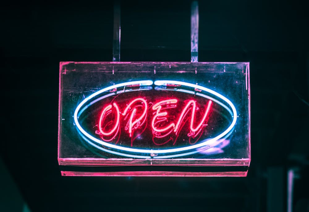 Neon pink and blue open sign