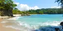 White beach and turquoise water in Quepos, Manuel Antonio National Park, in Costa Rica.