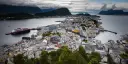 View of Ålesund and Hurtigruten Expeditions cruise ship in port