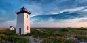 White lighthouse during sunset in Provincetown, Massachusetts.