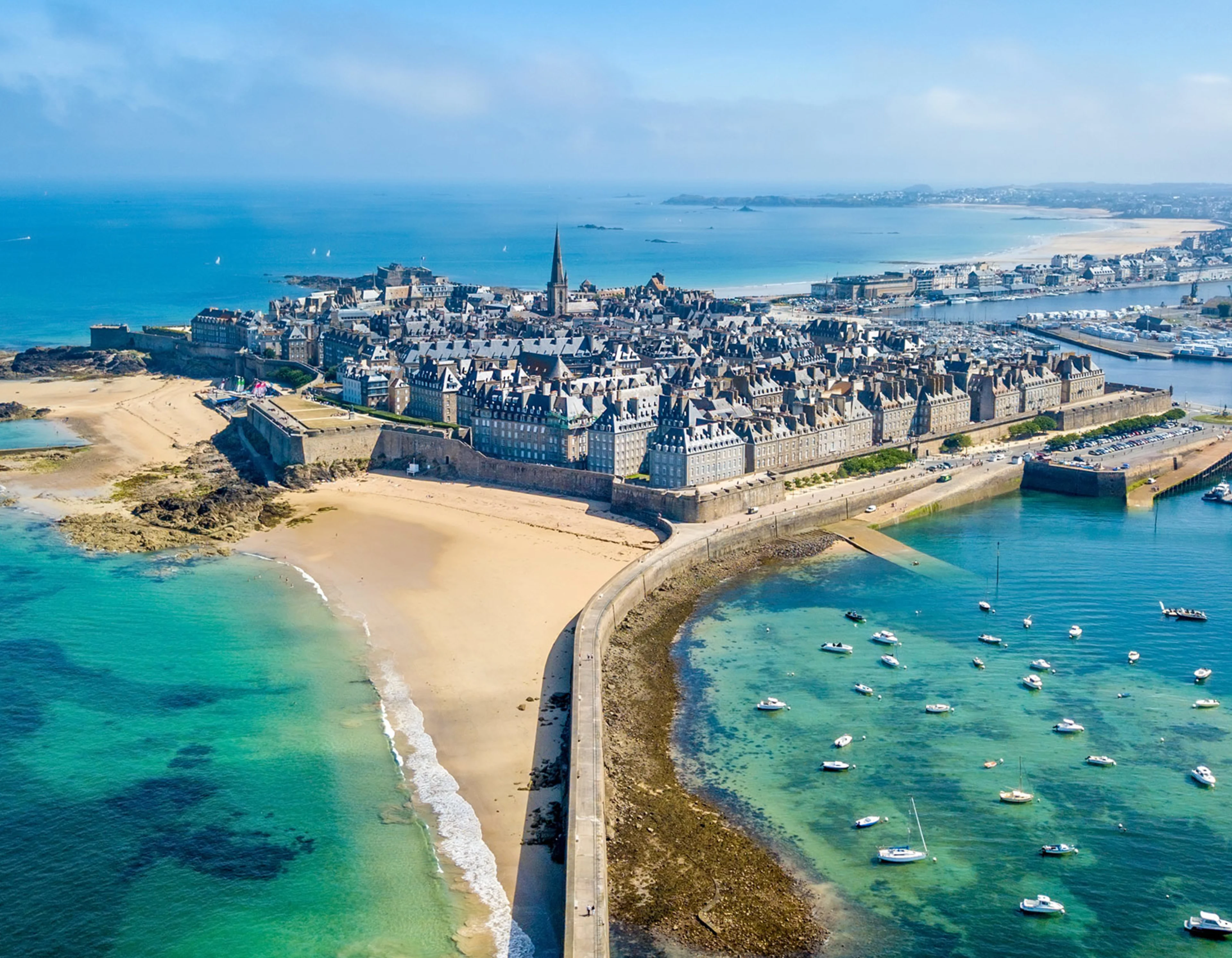 Saint Malo, France, from above. Old city surrounded by white beaches and blue water.