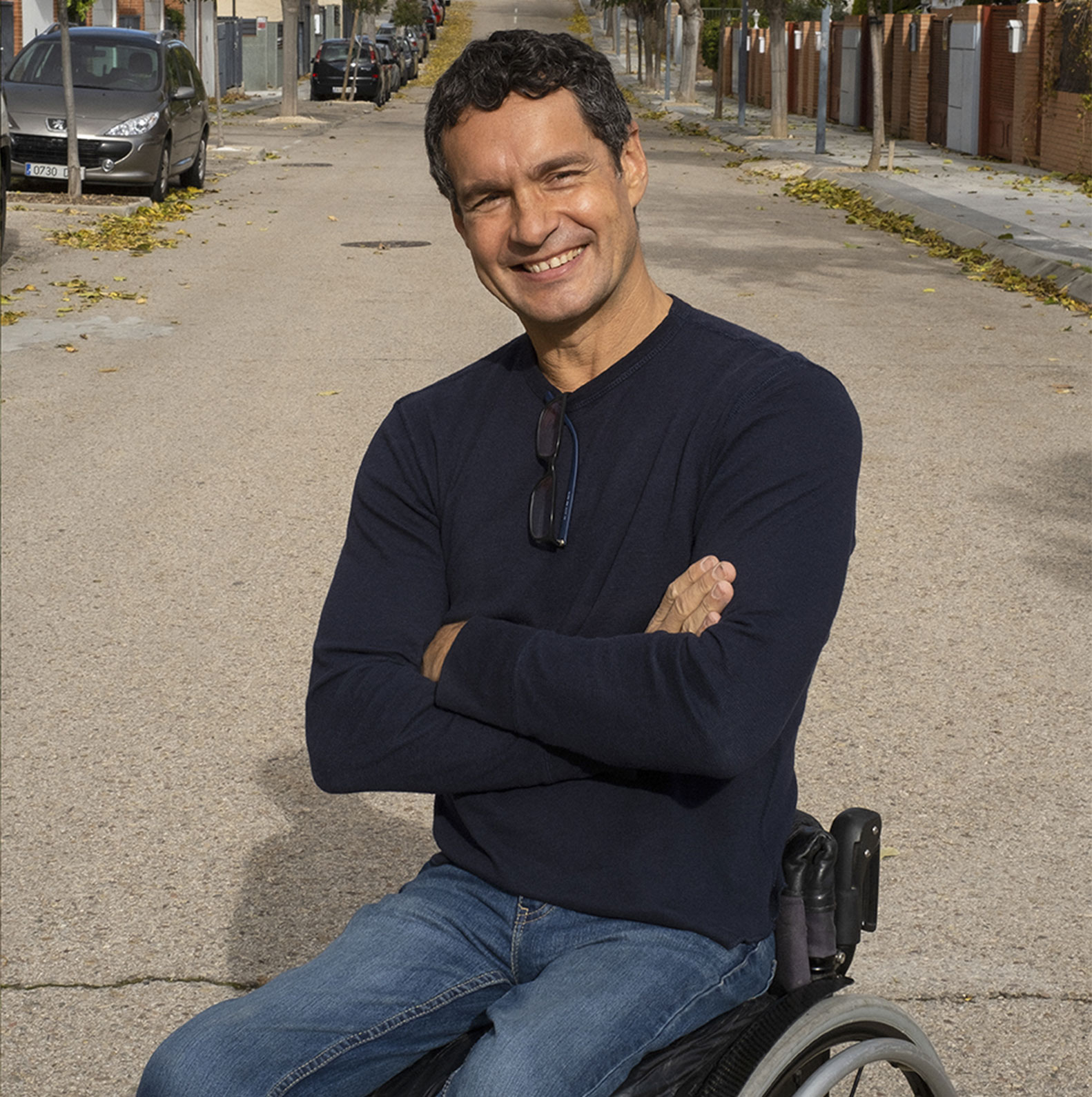 man on a wheelchair, smiling
