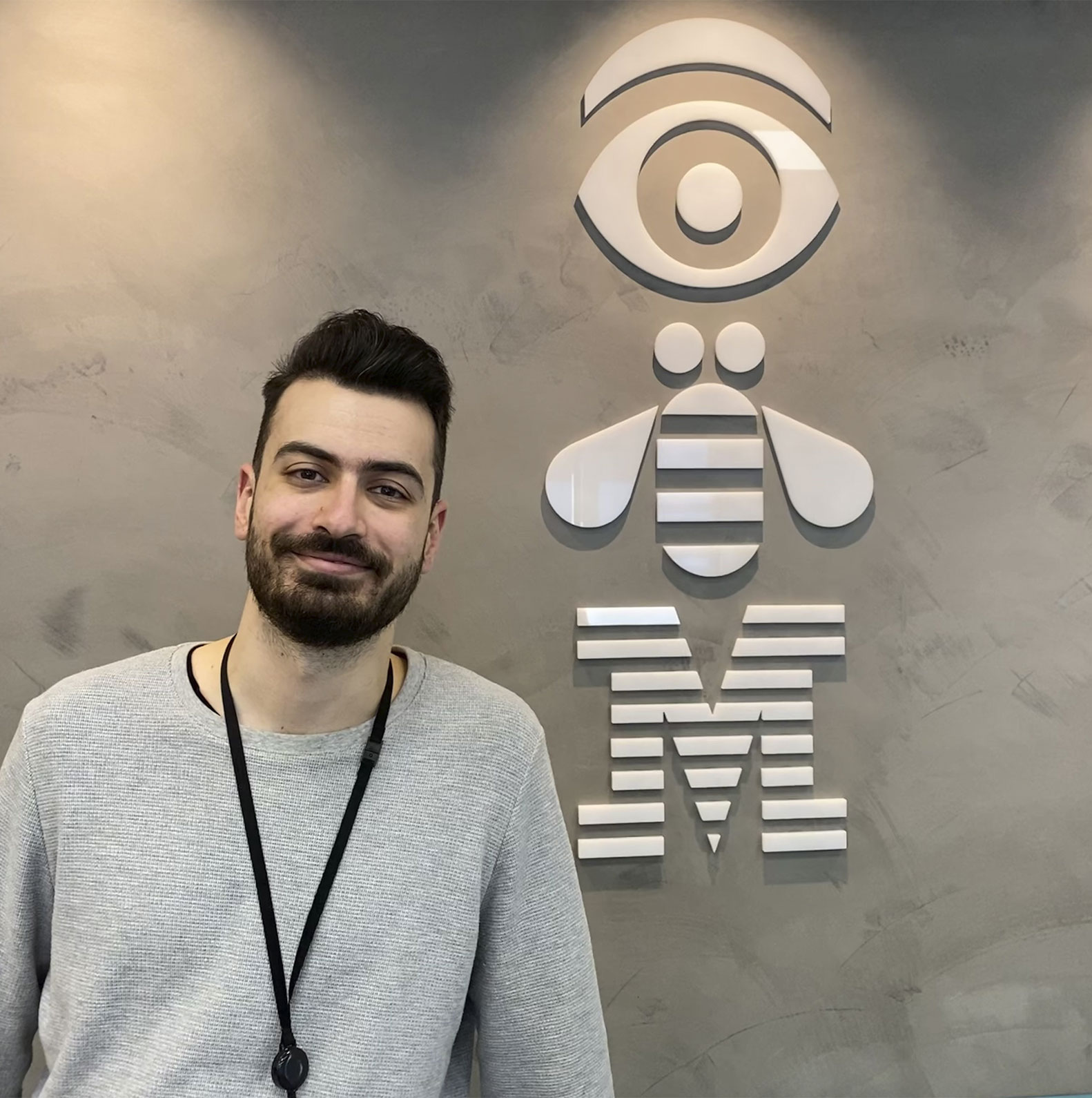 man in front of IBM sign