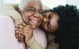 Daughter kissing mother on the cheek