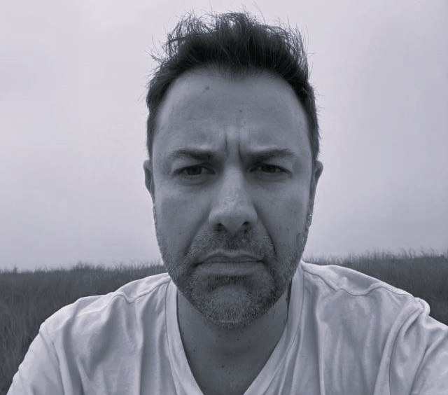 A headshot of Andrew Murphy