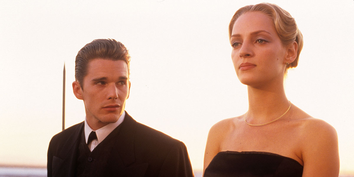 Ethan Hawke in a suit looking towards Uma Thurman in a black dress