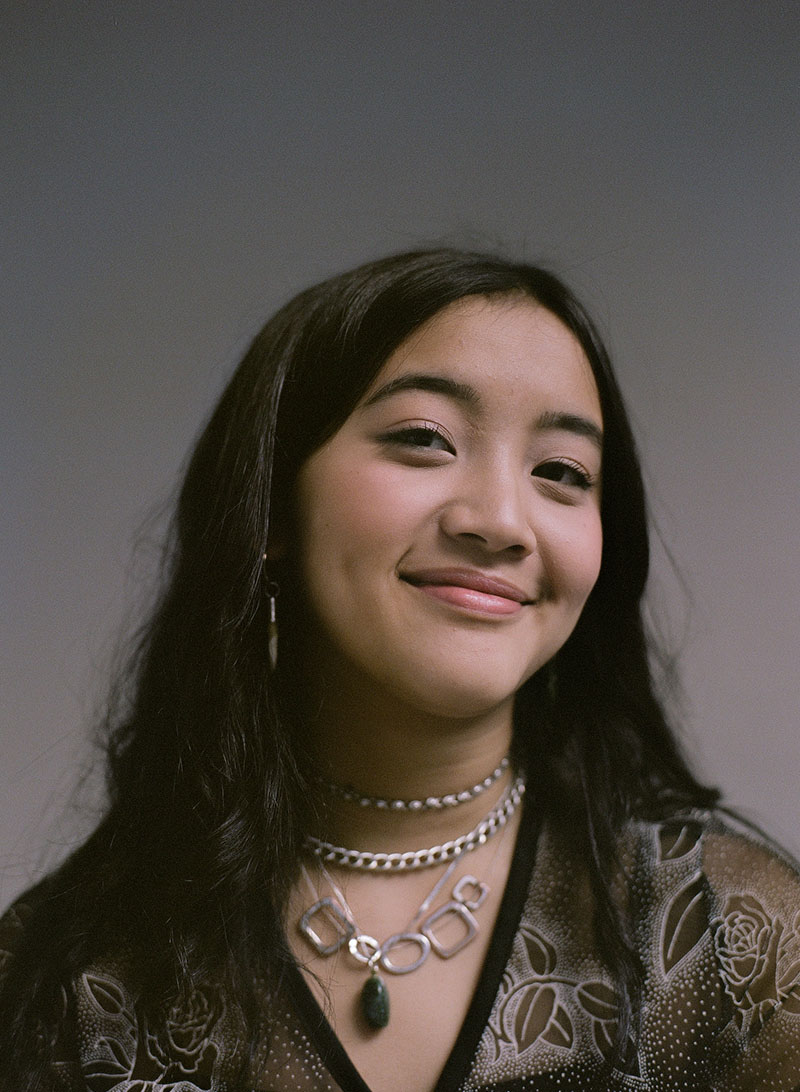 Photo of Julia Yoo on neutral background