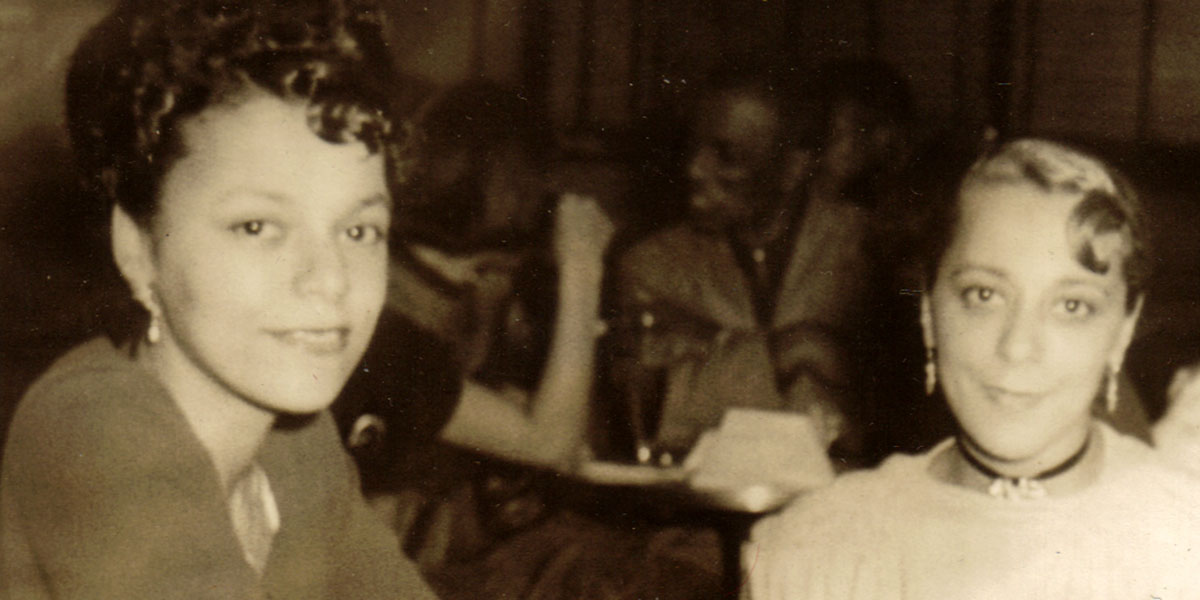 Viola Desmond (left) and Wanda Robson (right) looking at the camera in the Hi-Hat Club