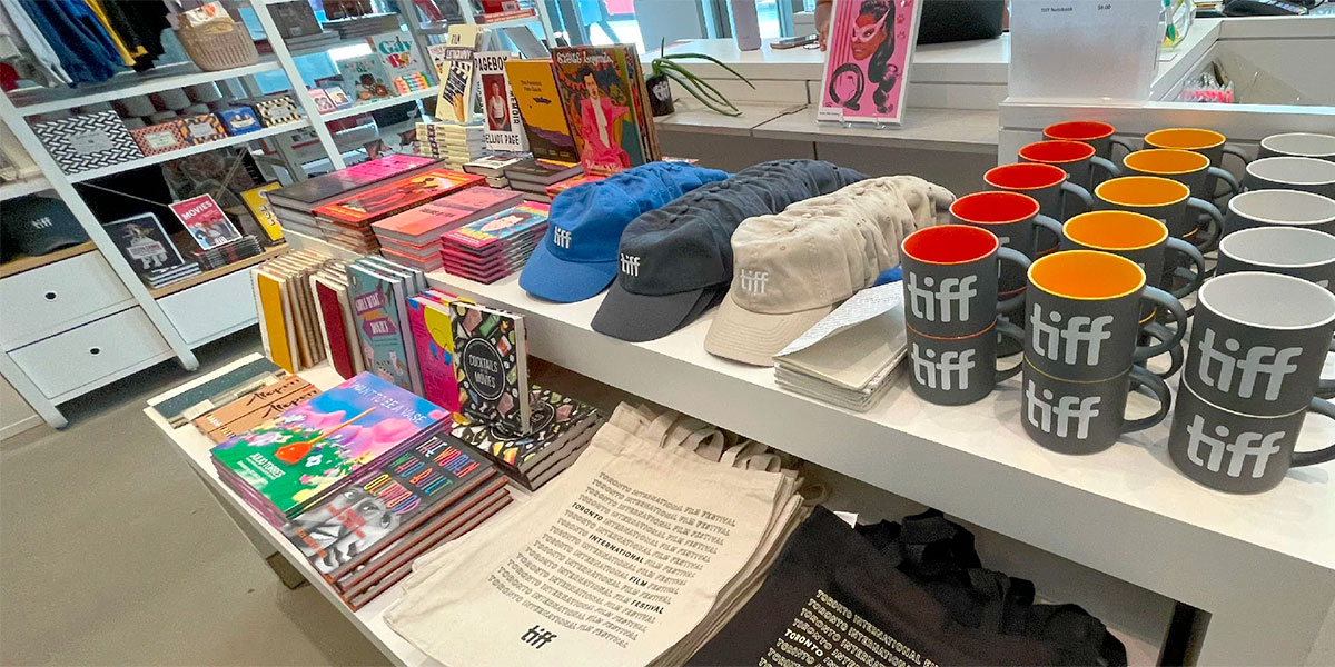 Interior shot of the TIFF Shop with tables full of merchandise