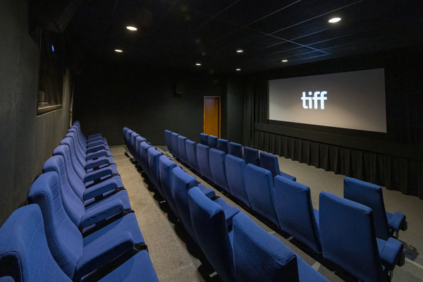 Interior shot of Cinema 6 with rows of empty seats