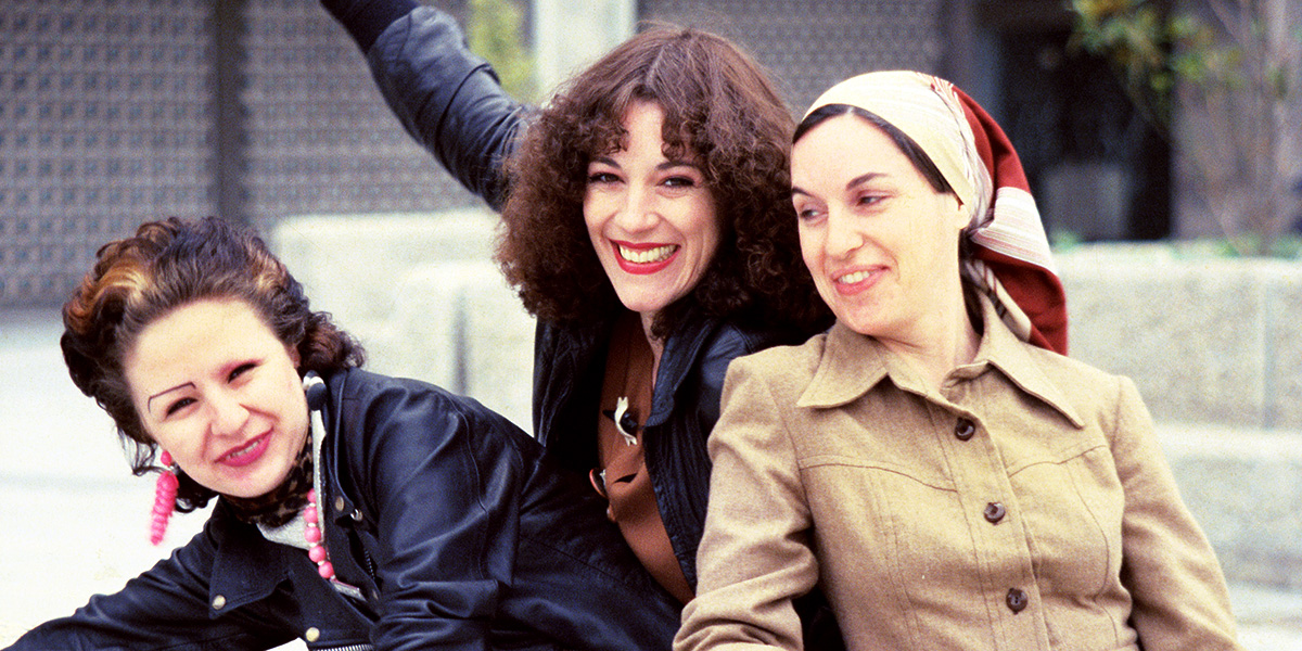 Three women having fun posing for the camera