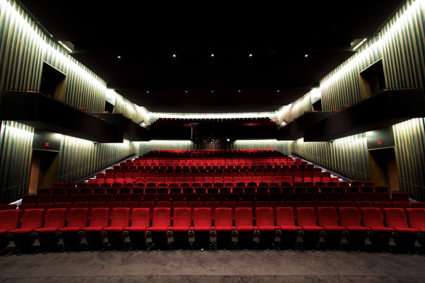 Interior shot of Viola Desmond Cinema with rows of empty red seats