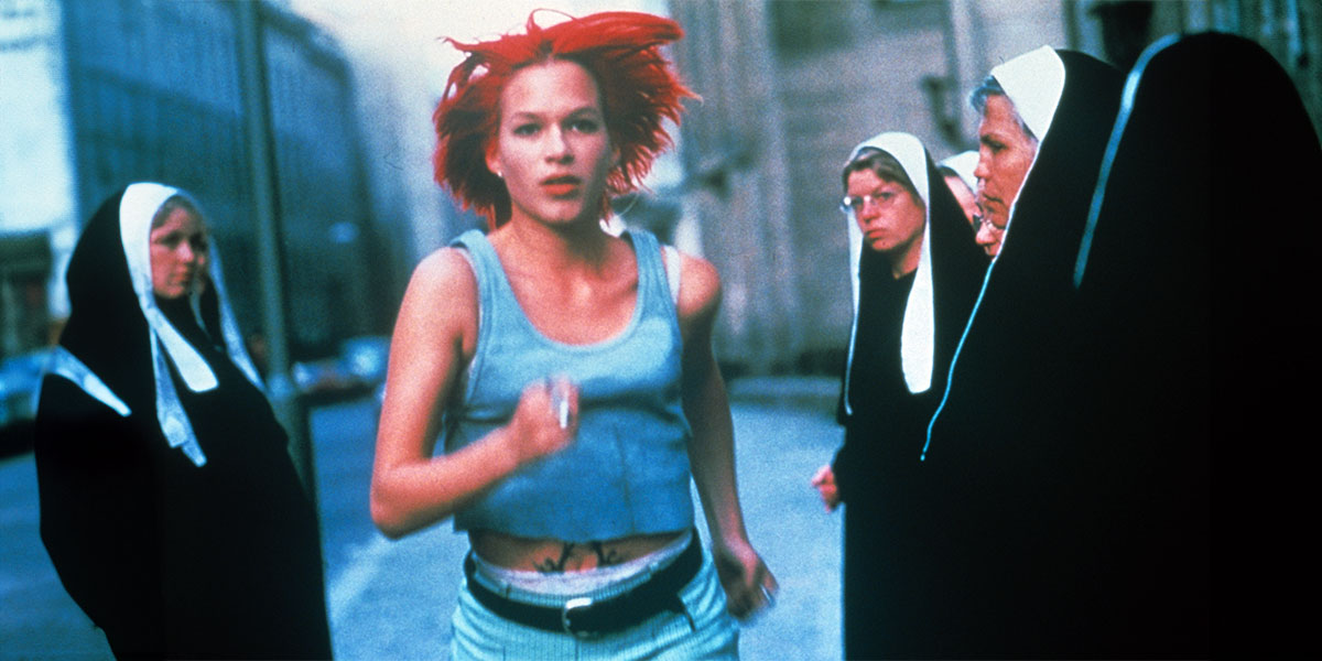 Lola (Franka Potente) running pass some nuns on the street