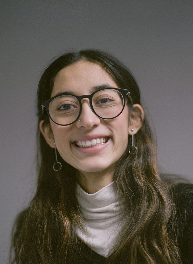 Photo of Emily Neira on neutral background