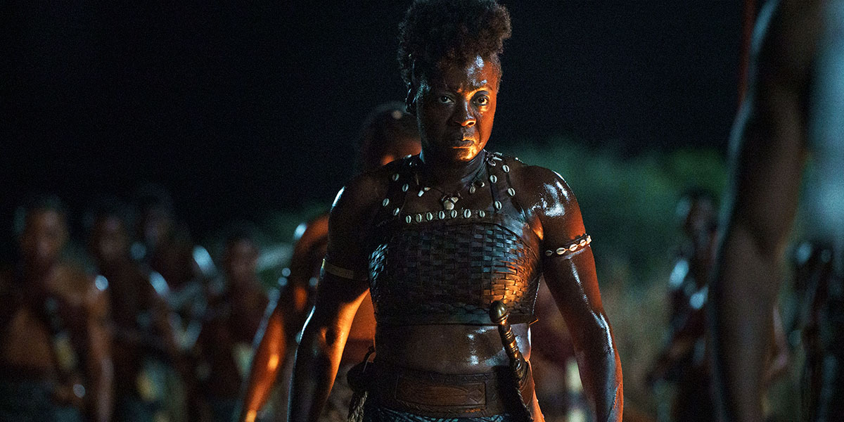 Nanisca (Viola Davis) standing amongst her fellow female warriors at night