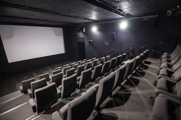Interior shot of Cinema 5 with rows of empty seats