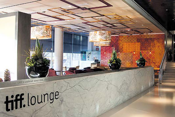 Interior shot of TIFF Founders Lounge with tables and chairs