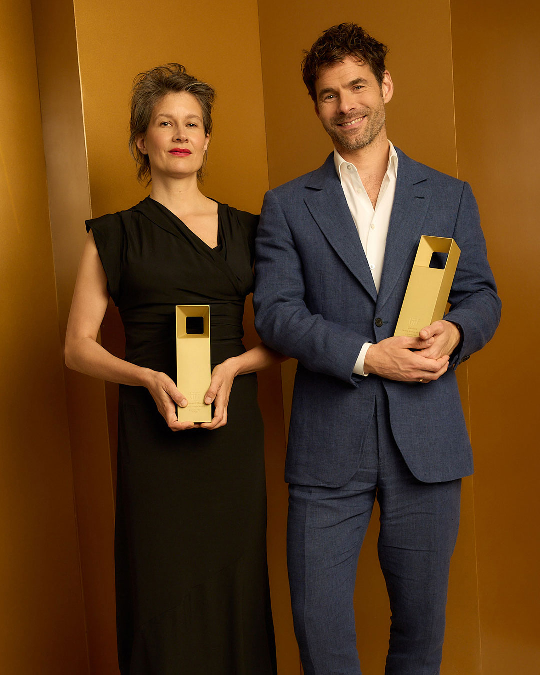 Portrait of Clément Ducol & Camille standing holding their awards