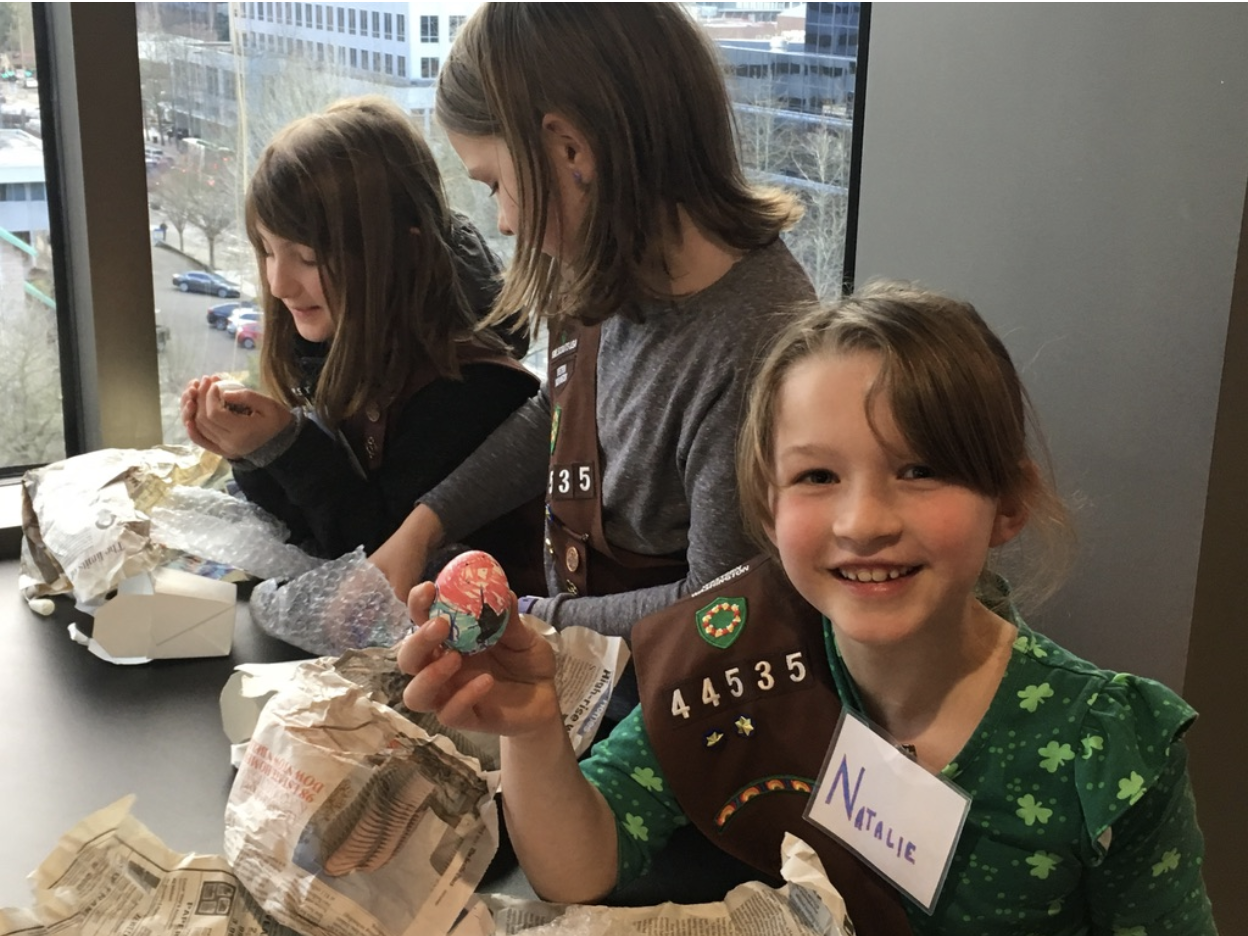 Scouts showing off the eggs that were protected in egg drop exercise