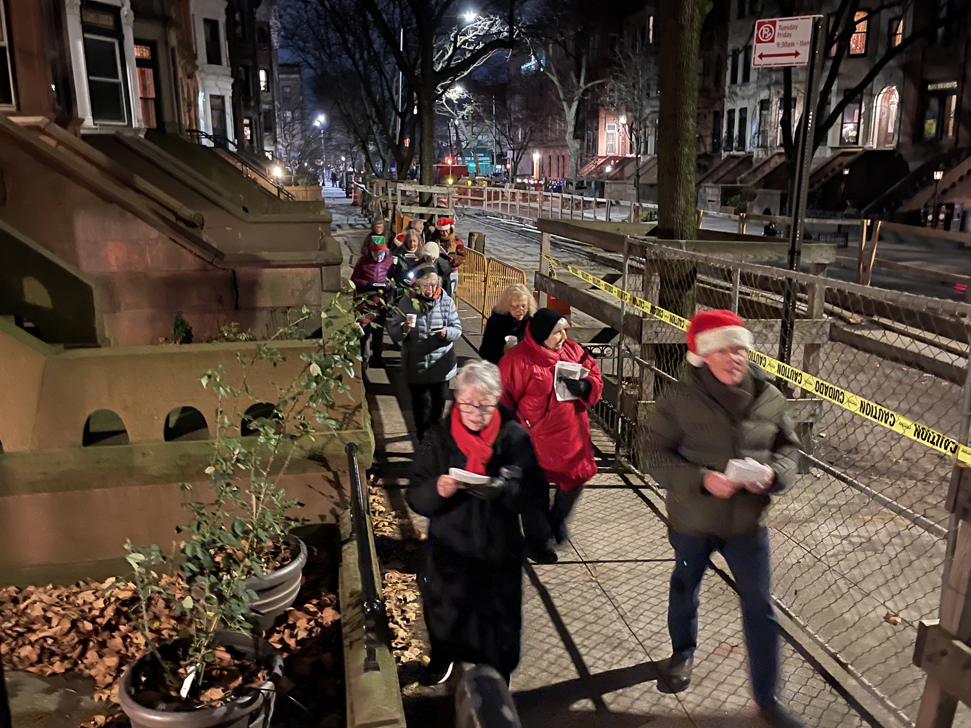 holiday caroling 2024-12-19 Marc Gordon 02 (carolers walking)