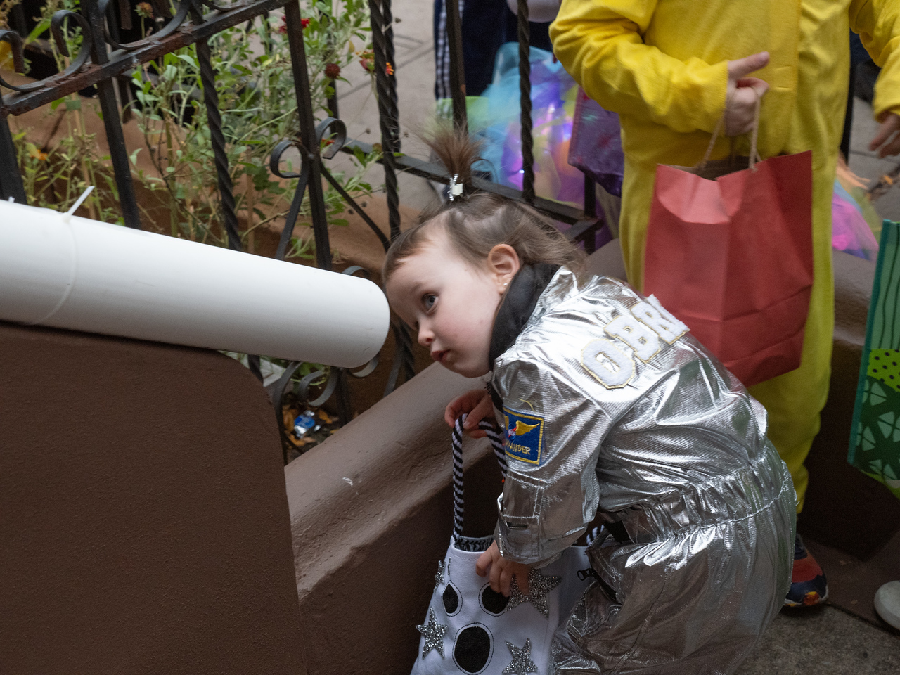 girl looking at candy chute