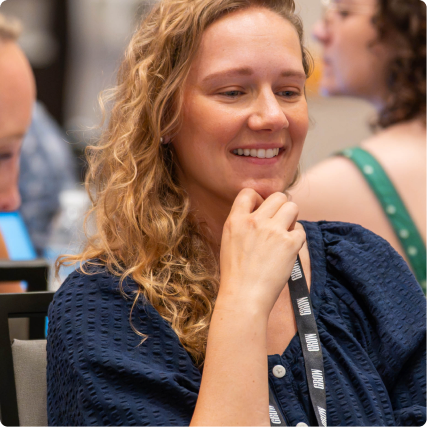 A Grow team member smiling during a company gathering.