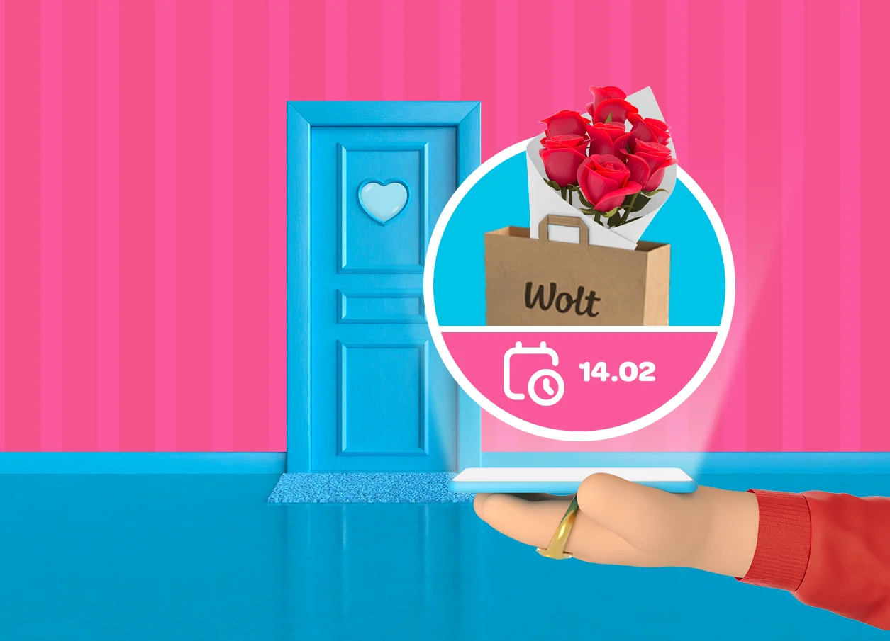 Illustration of a blue front door on a pink background, with a hand holding a phone showing a Wolt delivery of red roses scheduled for 14.02.