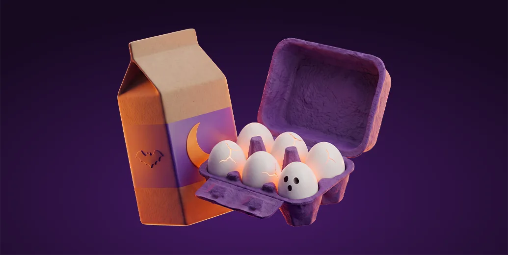 Halloween-themed milk carton with a bat and moon design next to an egg carton, one egg with a ghost face, on a dark purple background, representing groceries delivered with Wolt.