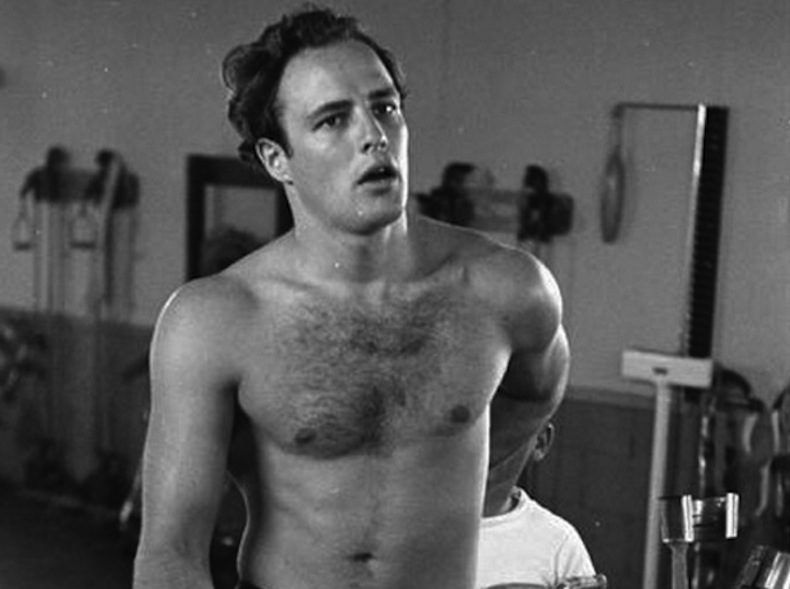 15 arresting photos of shirtless icons from Paul Newman to Brad Pitt.