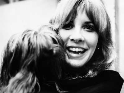 25 Snapshots Of Rock Stars And Their Dogs