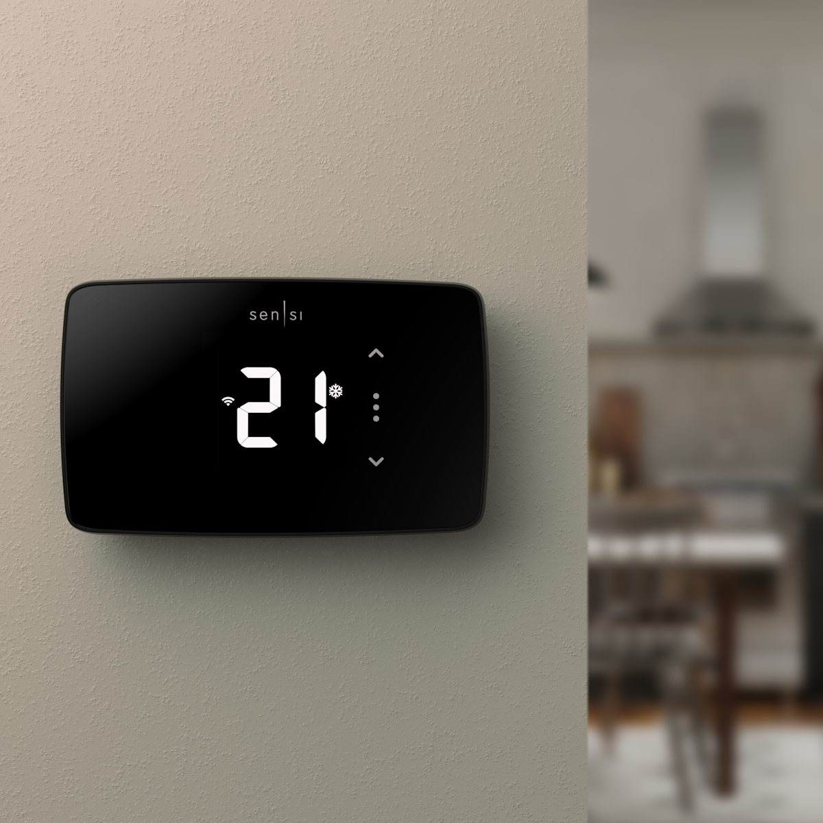 Un thermostat intelligent Sensi Lite sur le mur d’une maison.
