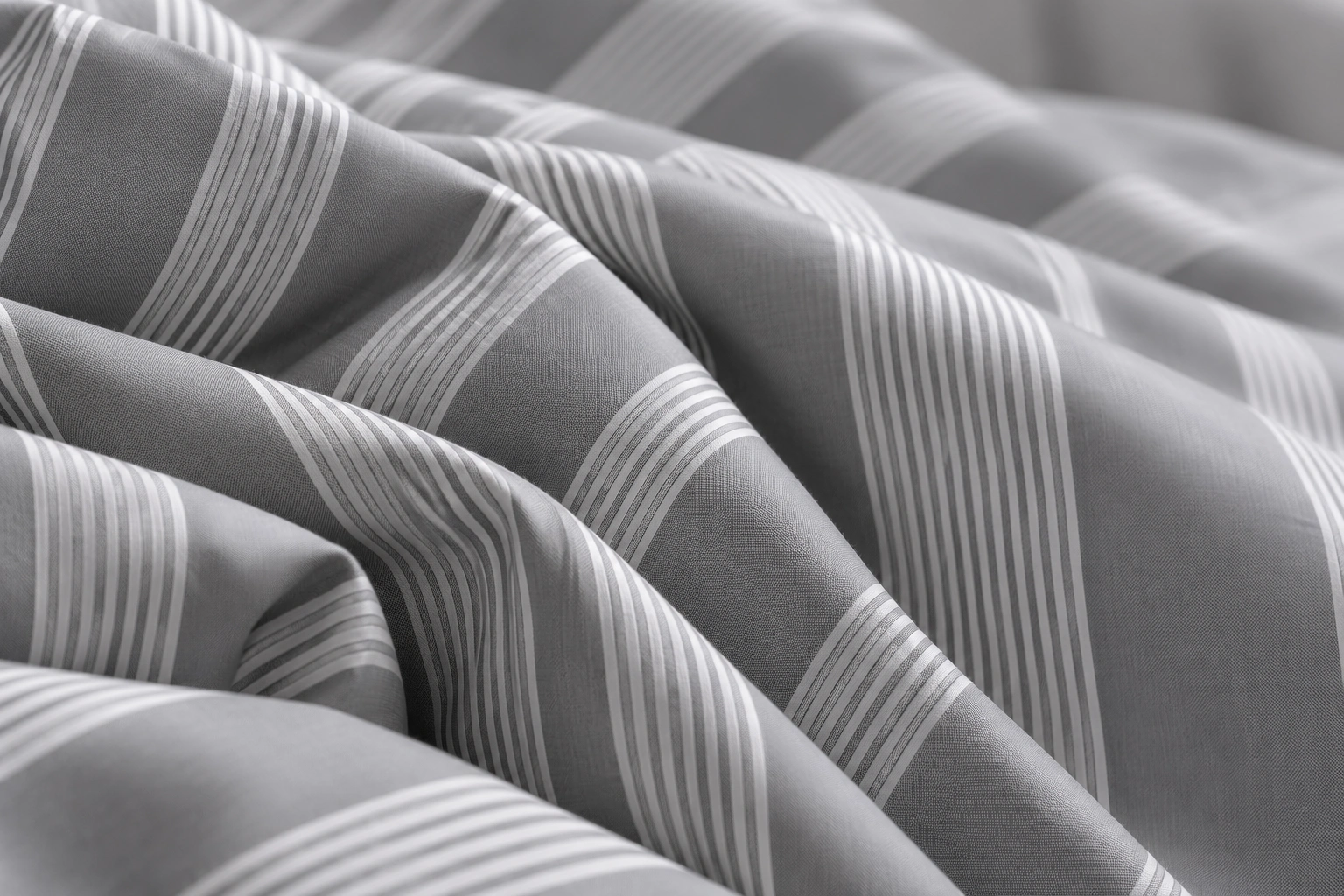 Grey cloth with fine white stripes gathered into soft folds