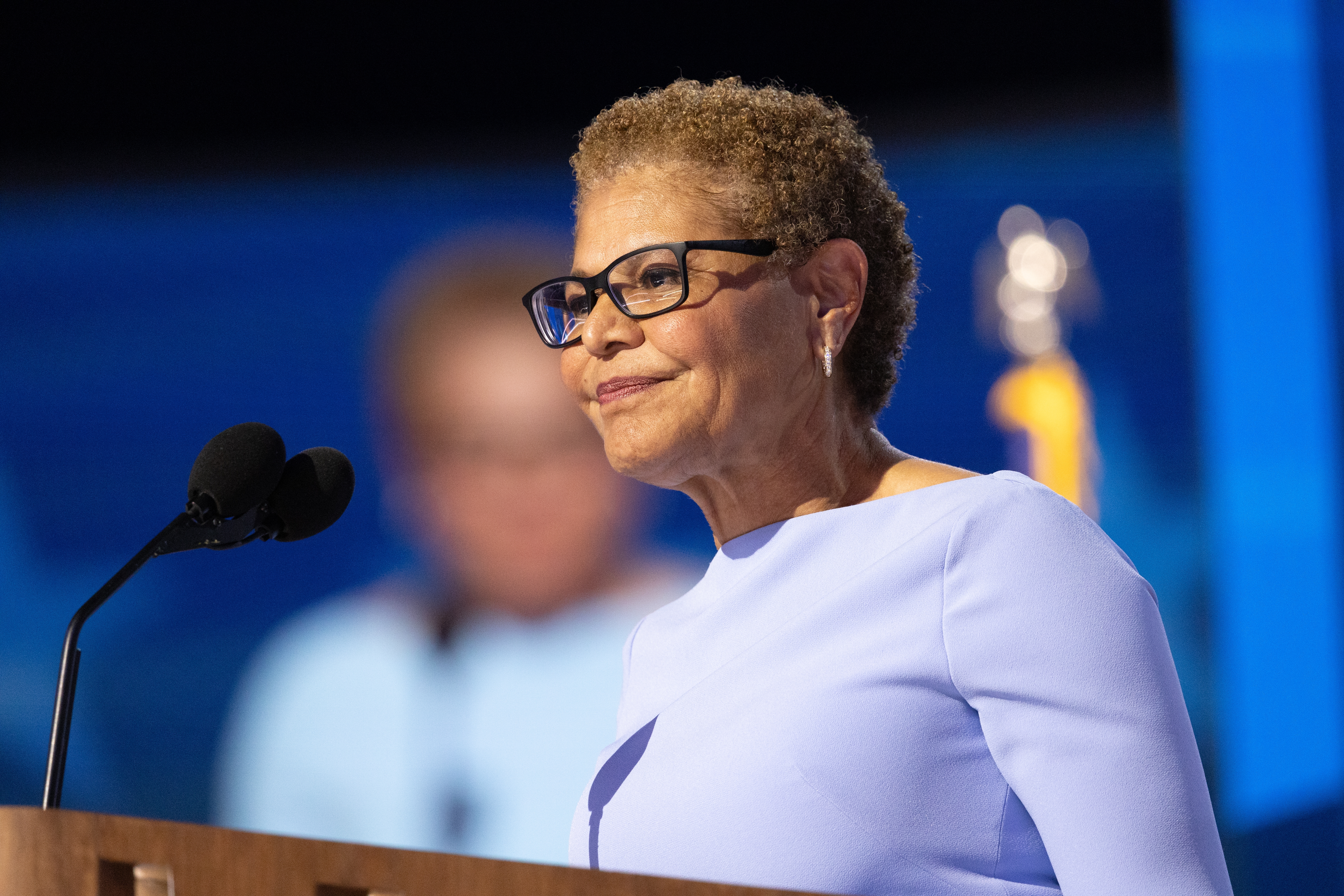 LA Mayor Karen Bass speaks at a podium.