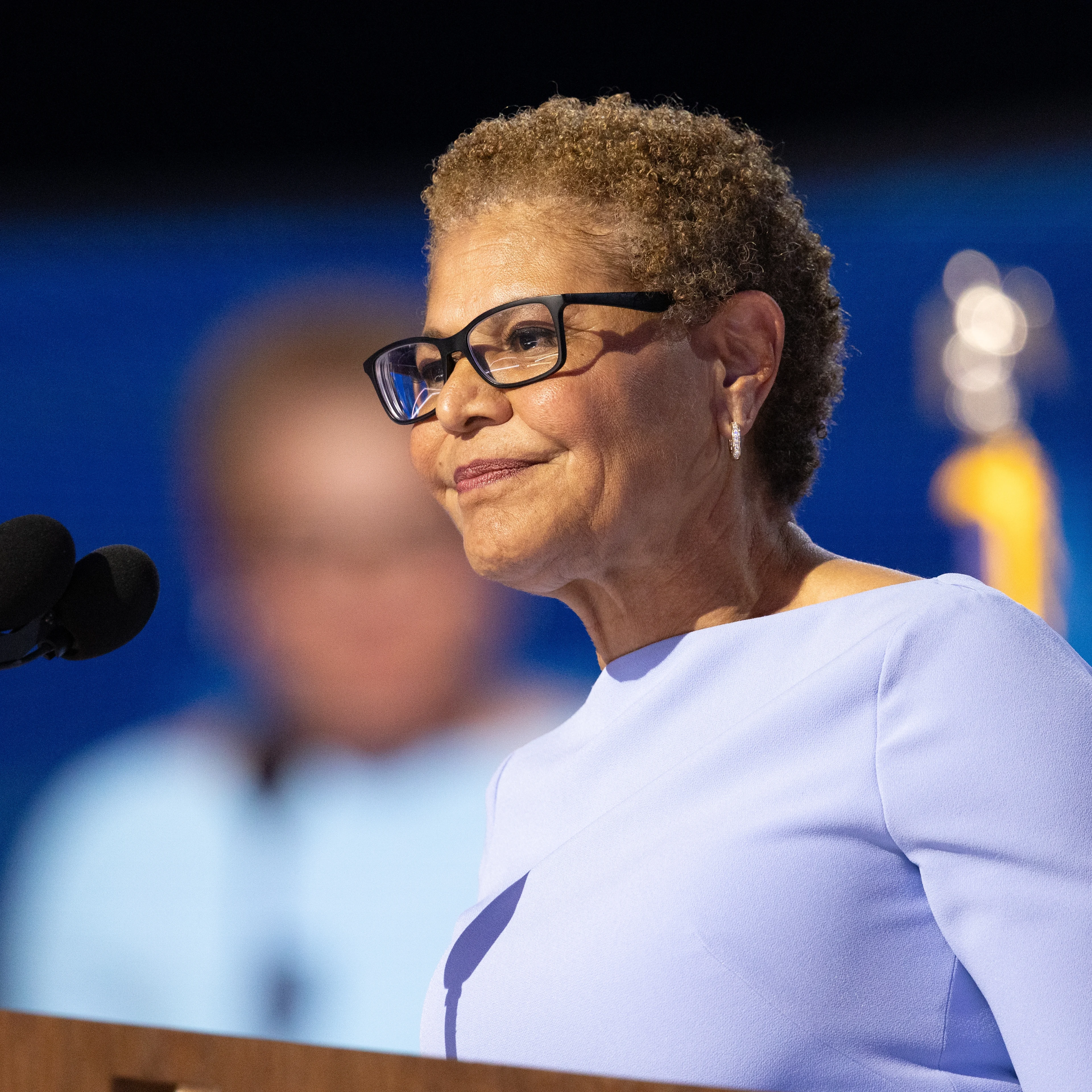 LA Mayor Karen Bass speaks at a podium.