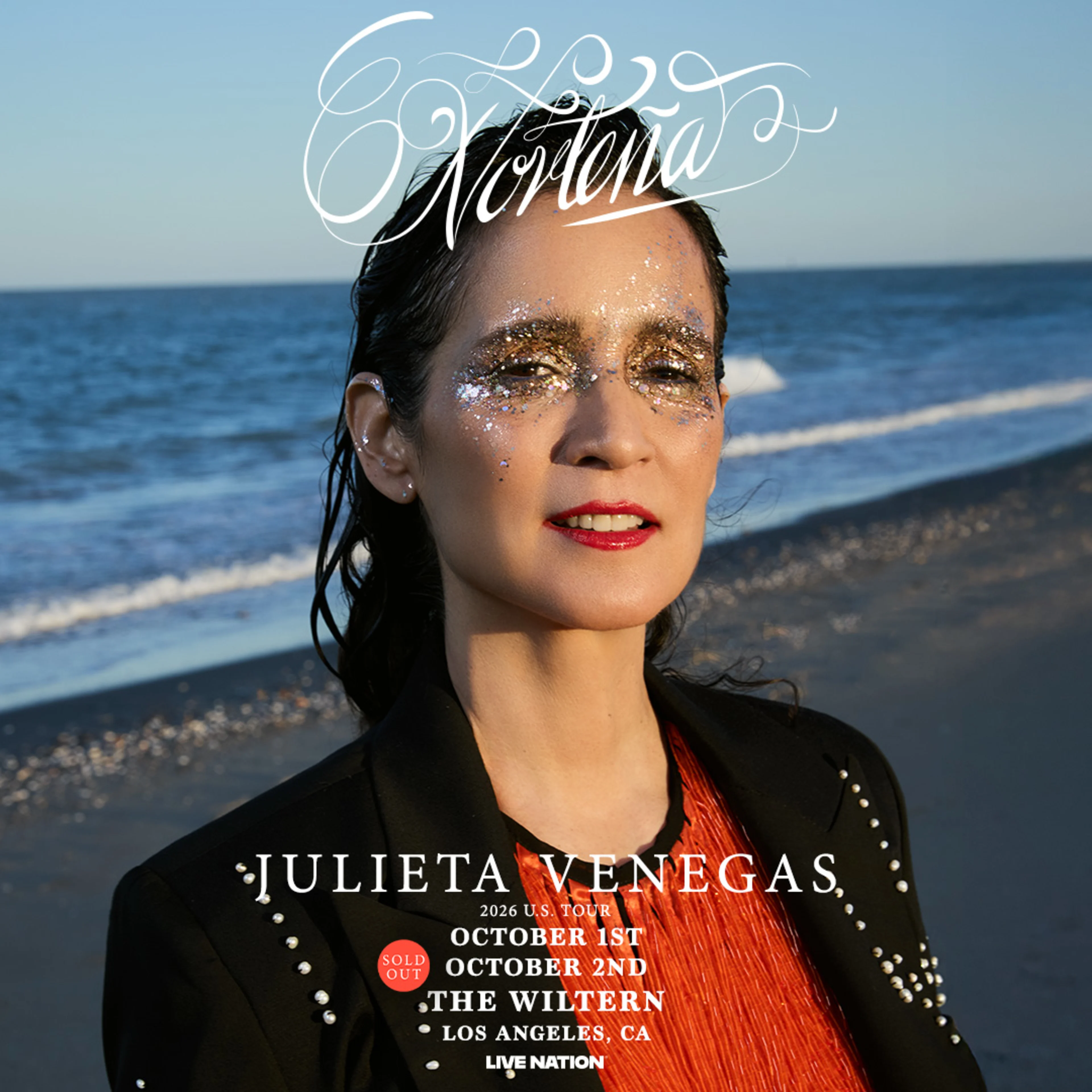Julieta Venegas Norteña tour poster featuring her on a beach with glitter makeup, red lips, and a black jacket.