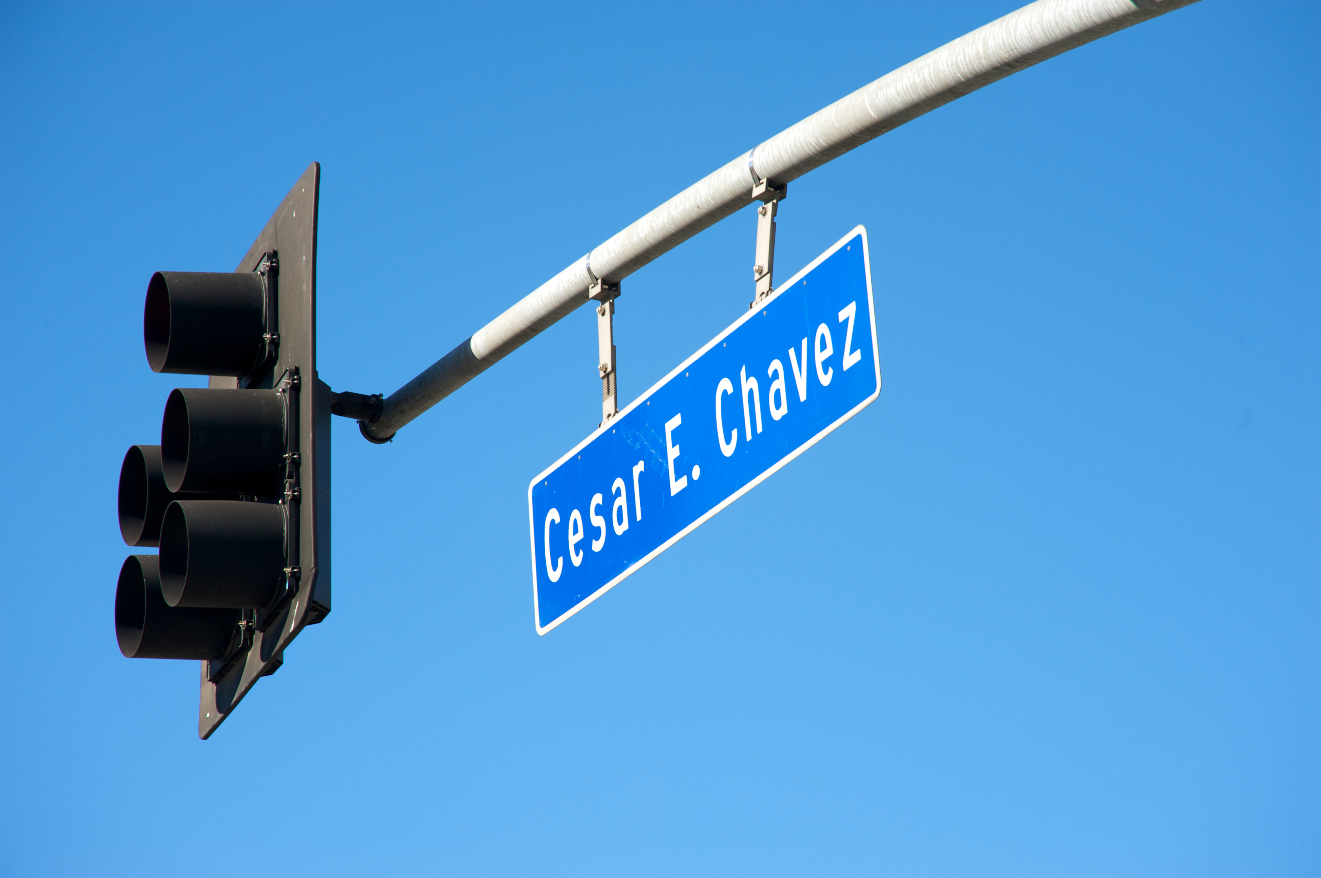 A picture of the road sign reading 'Cesar E Chavez'