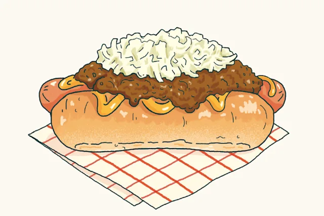 Illustration of a chili cheese hot dog topped with coleslaw, served on a red checkered napkin.