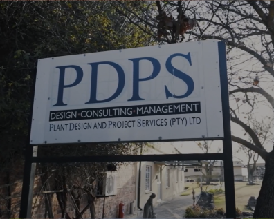 Outdoor sign for PDPS Plant Design and Project Services (PTY) Ltd, Design Consulting Management, mounted on poles with trees behind.