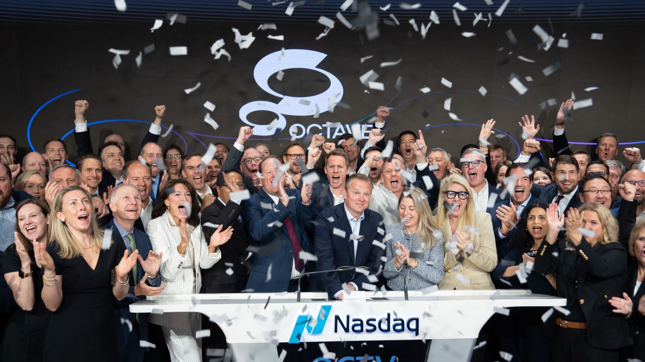 Octave rings bell at the Nasdaq in New York City.