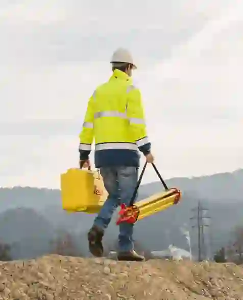 worker with yellow box