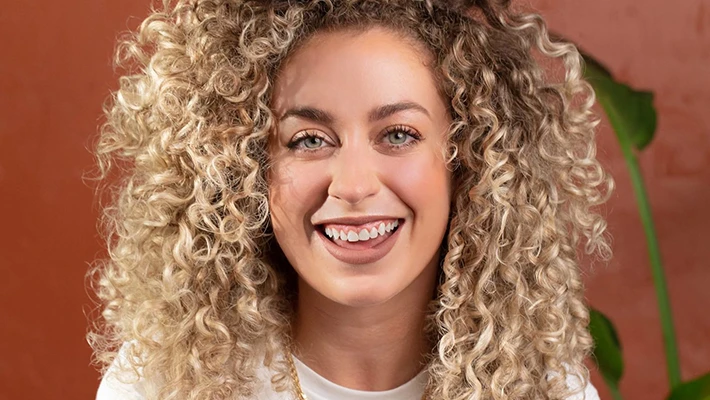 Maui Moisture talent touching hair