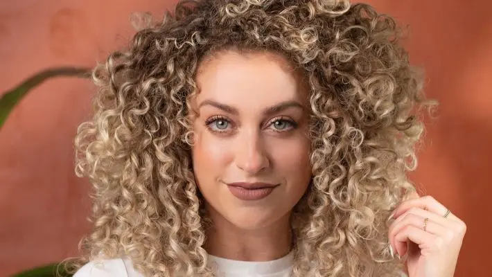 Maui Moisture talent touching hair