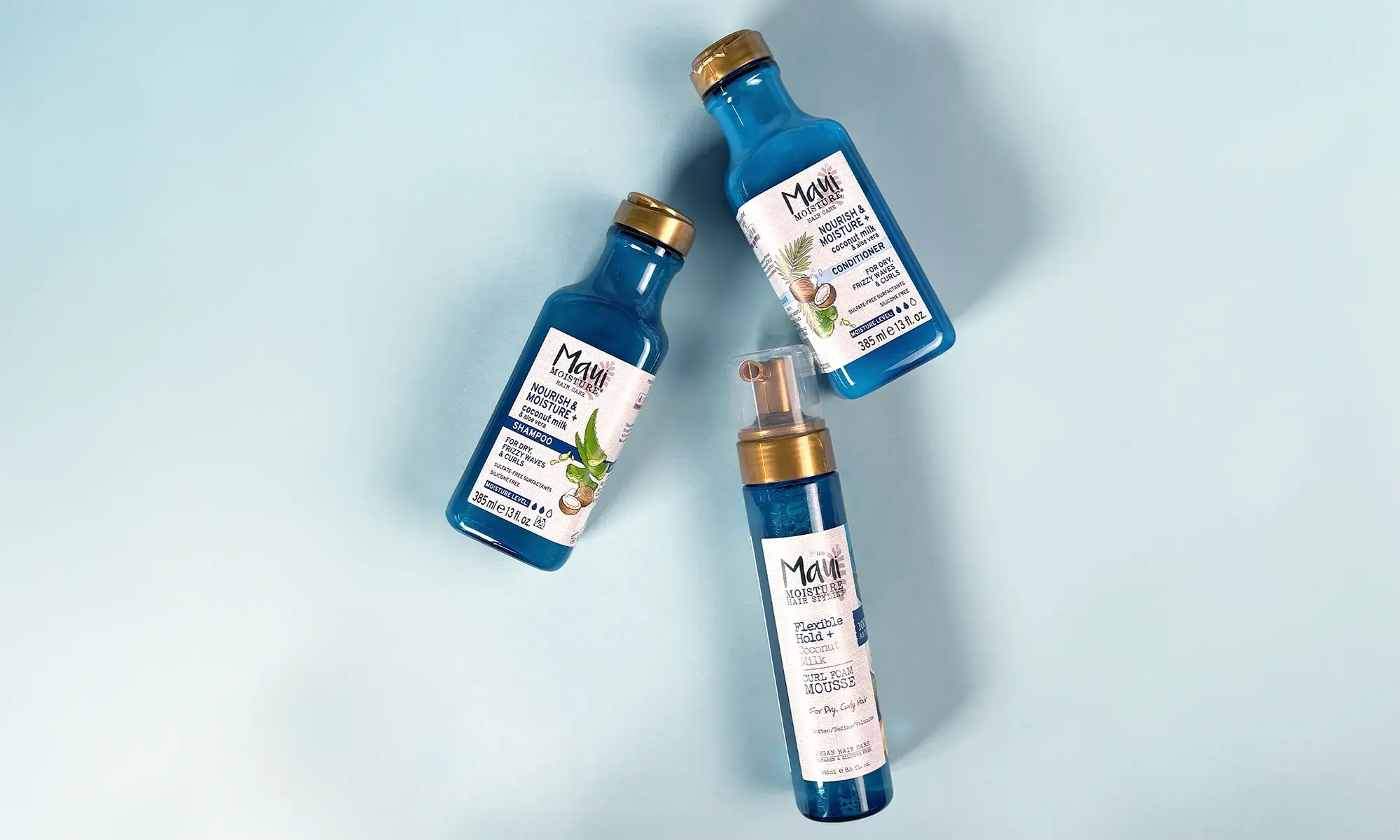 Maui Moisture® Nourish & Moisture + Coconut Milk product line, including shampoo, conditioner and curl foam mousse