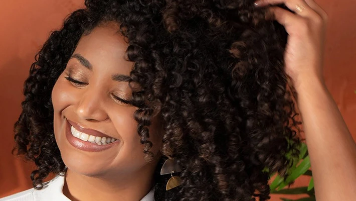 Maui Moisture talent touching hair