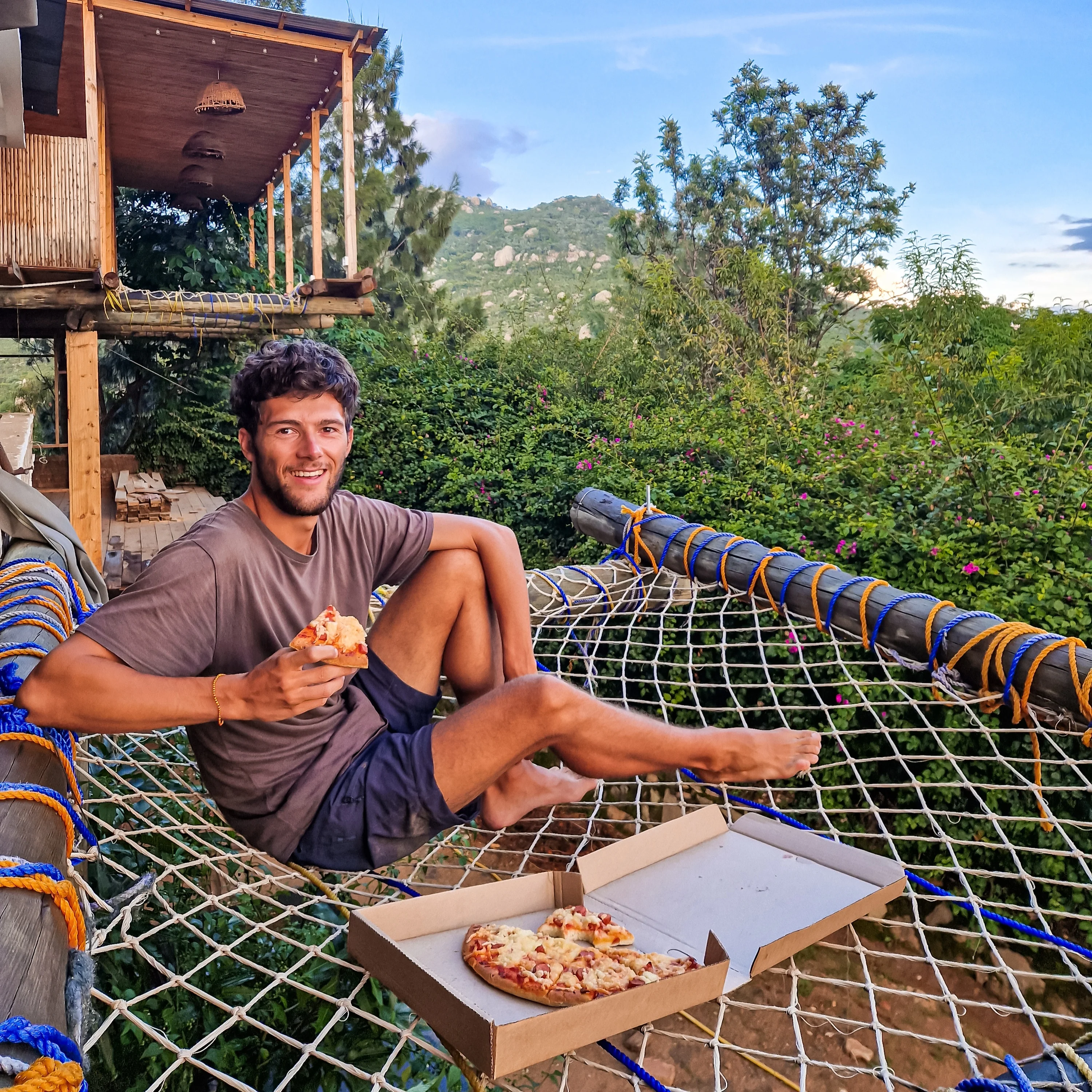 Chilling on the nets at Hidden Valley Backpackers, overlooking the city