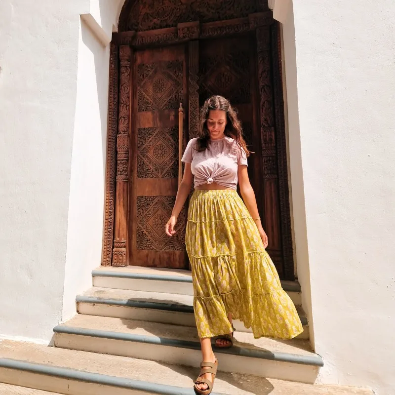 Lisa in front of a typical swahili door in Stone Town