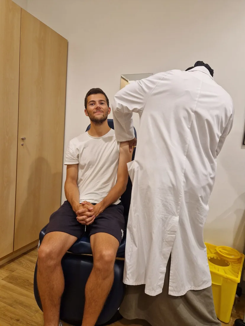Pol getting vaccinated