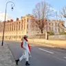 Lisa crossing the street in front of Saint Germain en Laye Castle