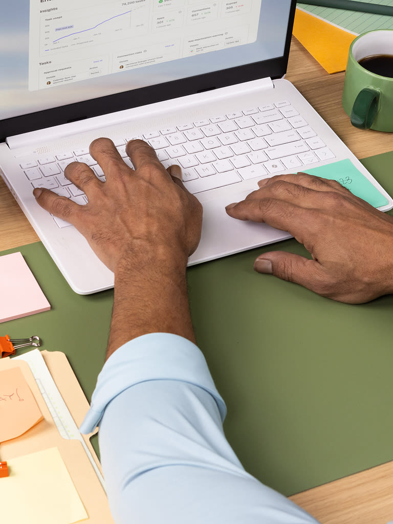 Close up of a person working on a laptop